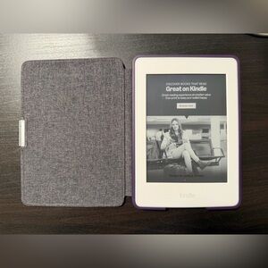 7th Gen. Amazon Kindle paper white with purple case